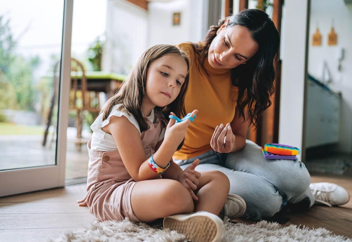 Child playing quietly with adult