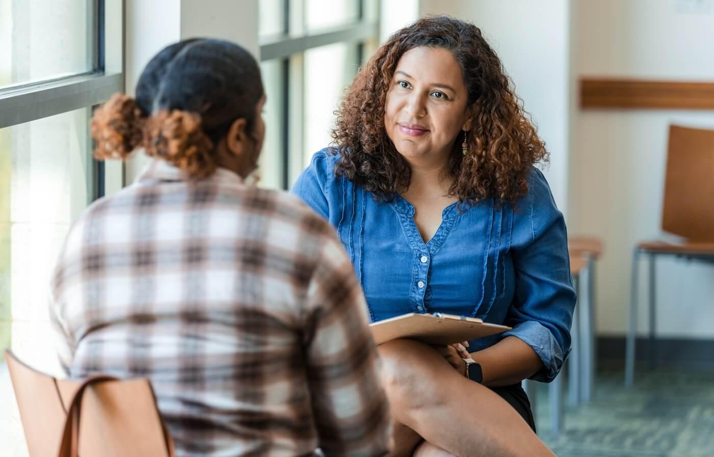 Young adult talking with therapist.