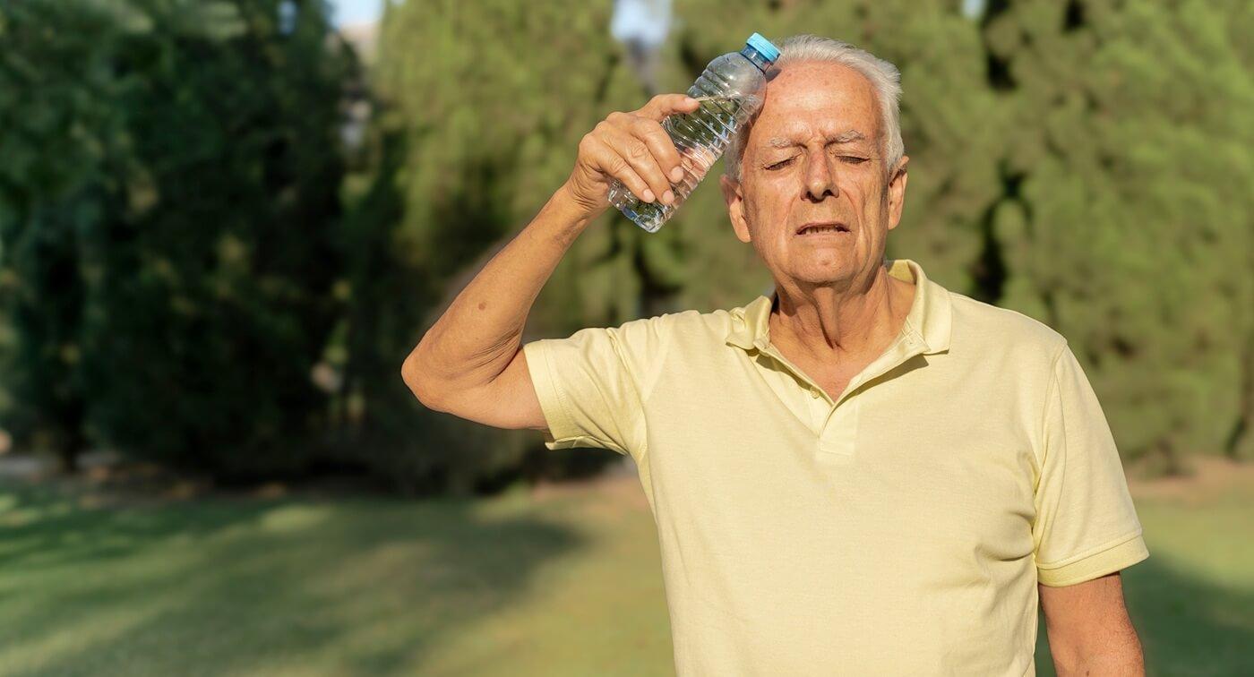 Senior man experiencing heat exhaustion.