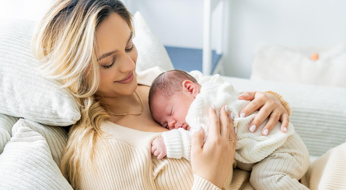 Young mother holding newborn baby